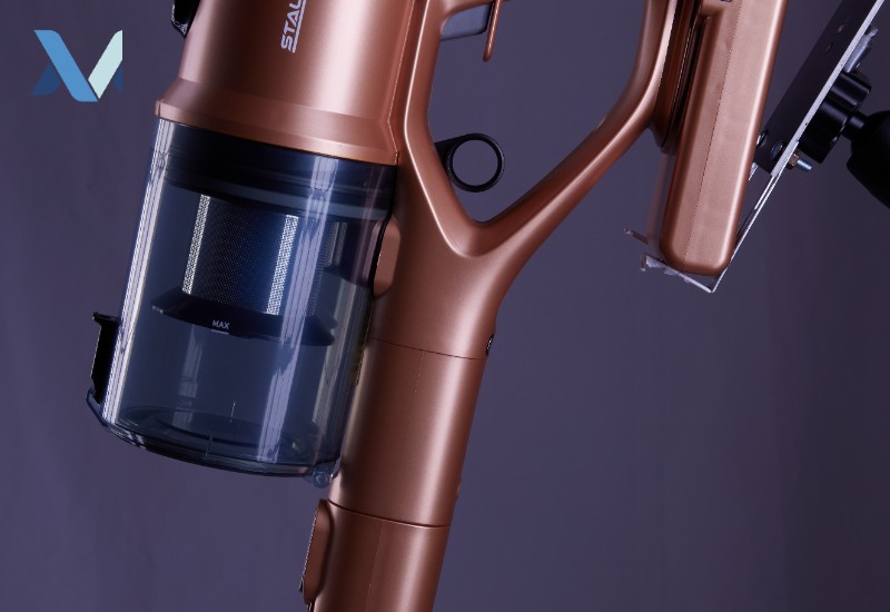 Close-up of a cordless stick vacuum cleaner handle